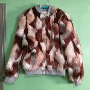Size Medium: Chaser, Faux fur calico in shades of pink.